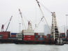 Barge WF 10 geared up containers to terminal