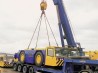 Gearing up of aircraft tractor onto low-bed trailer