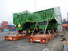2 cotton pick-up machines waiting for being loaded onto feeder